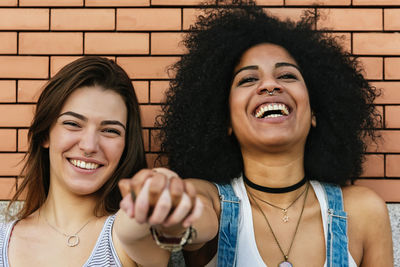 Portrait of female friends in city