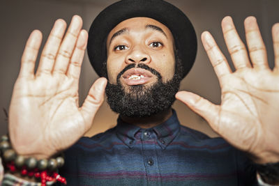 Portrait of young man wearing hat