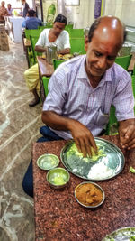 High angle view of man preparing food