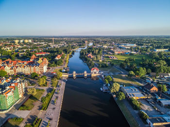 High angle view of road by buildings against sky