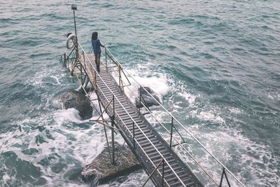 High angle view of flowing leading towards sea