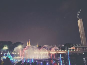 Panoramic view of crowd at music concert against sky