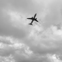 Low angle view of airplane in sky