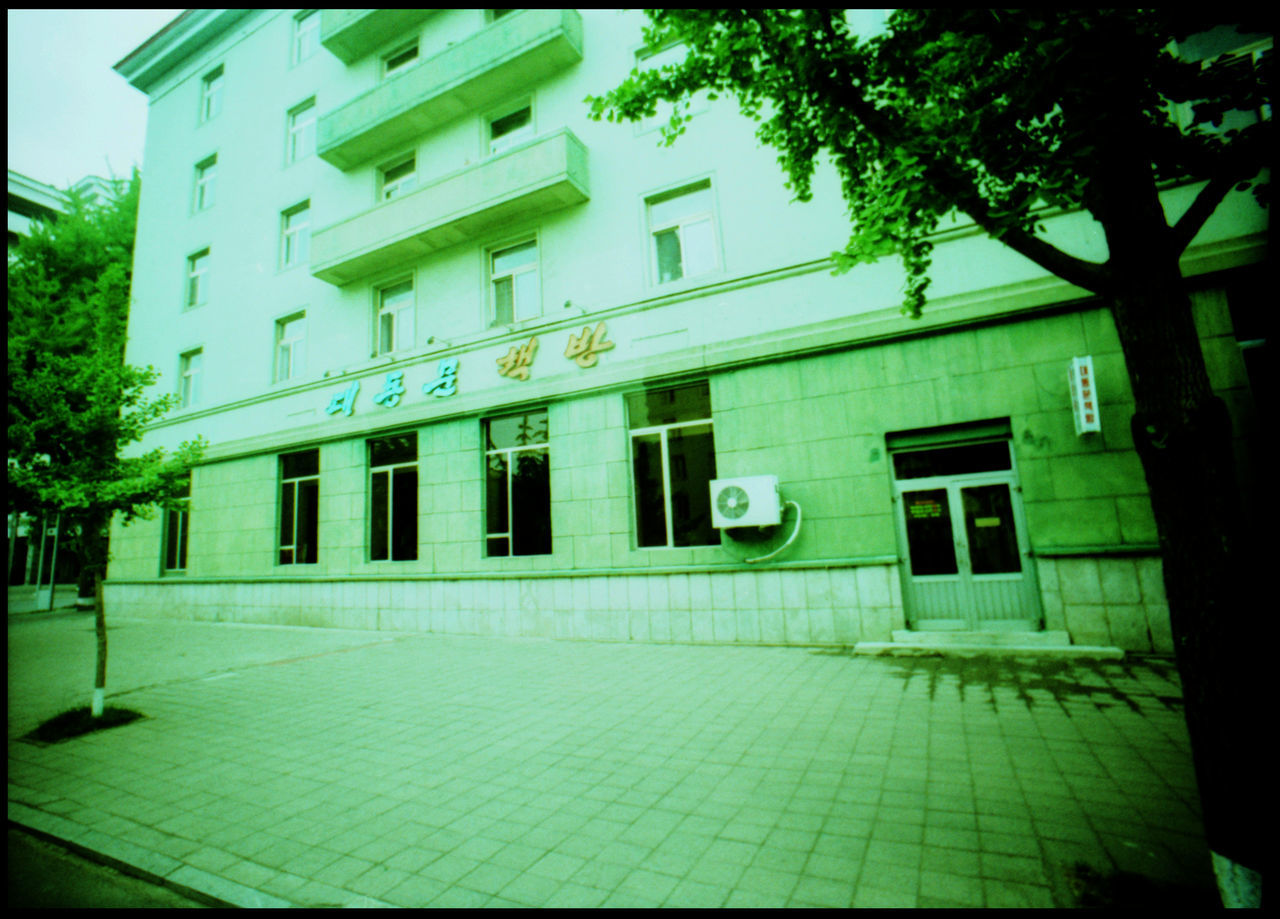 Within the Streets of Pyongyang Analogue Photography Architecture Armchair Armchair Row ASIA Bridge Dog Dish DPRK Eating Dog Hotel Hotel Telephone Hotel Window Juche Kim Il Sung Lomography Marching Northkorea Propaganda Pyongyang Pyongyang Skyline Pyongyang Streets Seats In Row Street Xpro Yanggakdo