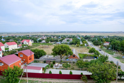 High angle view of houses and buildings against sky