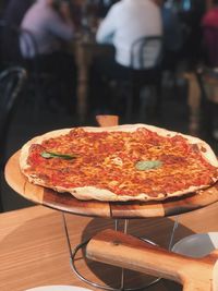 Close-up of pizza on table in restaurant