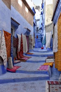 Low section of woman standing in swimming pool