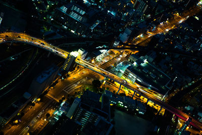 Aerial view of illuminated city at night