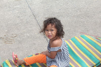 Portrait of girl sitting on beach