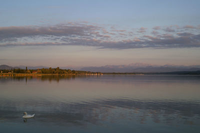 Scenic view of lake against sky during sunset