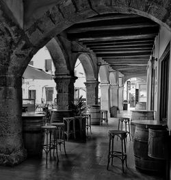 Empty chairs and tables in building