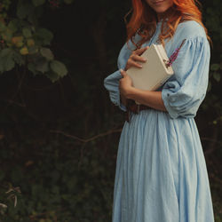 Red hair woman with book