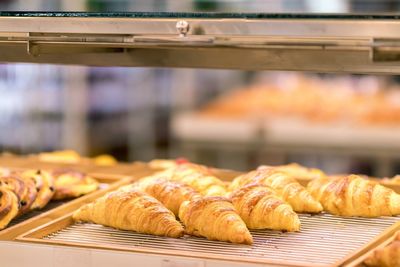 Close-up of croissant on cooling rack