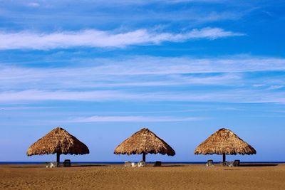 Scenic view of sunshades on beach