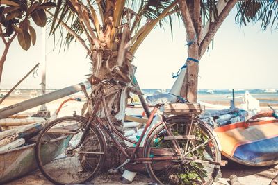 Bicycles on beach against clear sky