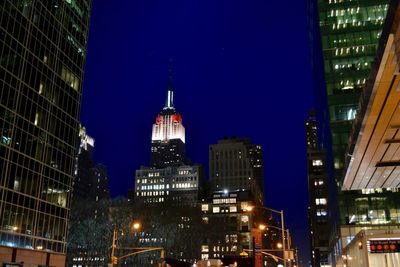 Low angle view of illuminated buildings at night