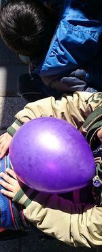 Close-up of boy holding umbrella