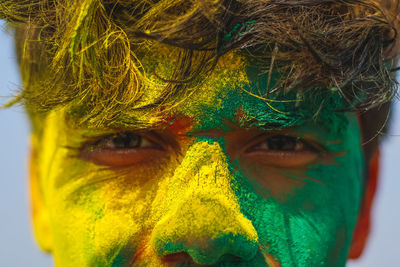 Portrait of man with powder paint outdoors