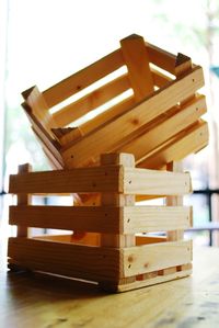 Close-up of wooden chairs on table