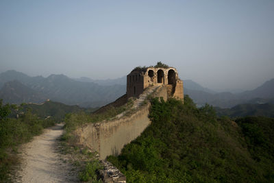 Castle on mountain against sky