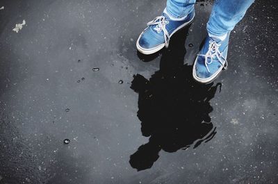 Low section of people in puddle