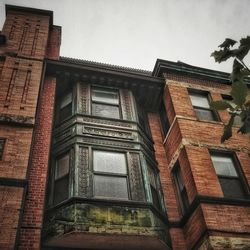 Low angle view of old building against sky