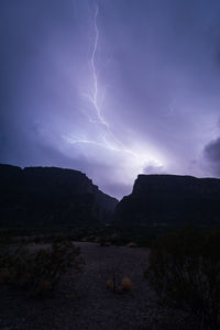 Panoramic view of lightning over mountain