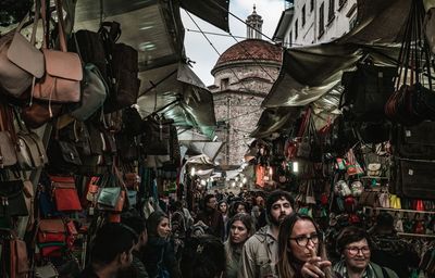 People at market stall in city