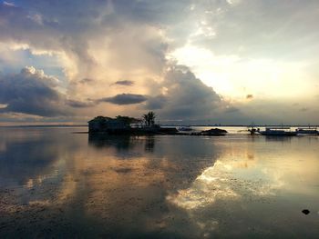 Scenic view of sea against cloudy sky