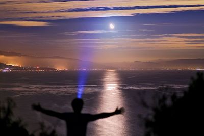 Scenic view of sea against sky at sunset