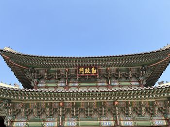 Low angle view of historical building against clear blue sky