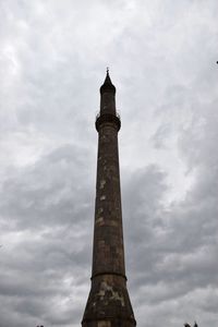 Low angle view of tower against cloudy sky