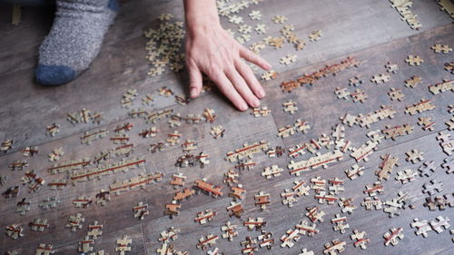 High angle view of hands on table