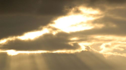 Low angle view of cloudy sky at sunset