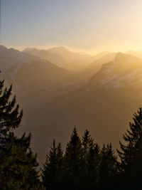 Scenic view of mountains against sky during sunset