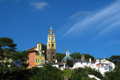 Buildings against blue sky and clouds