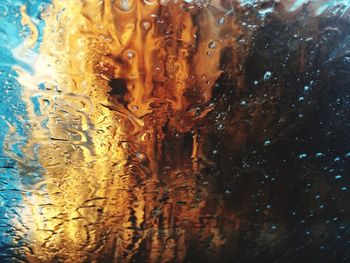 Close-up of water drops on glass