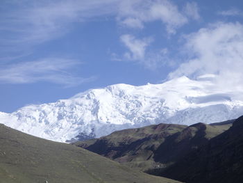 Scenic view of snowcapped mountains against sky