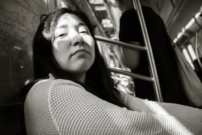 Portrait of teenage girl sitting at the train