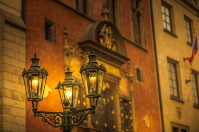 Low angle view of illuminated street light at night