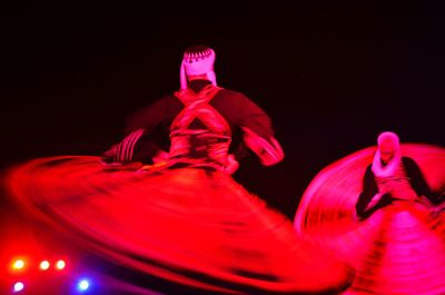 Close-up of red lights over black background