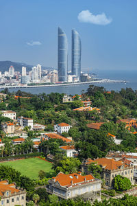 Buildings in city against sky