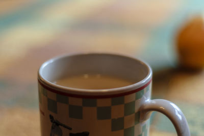 Close-up of coffee cup on table