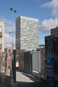 Buildings in city against blue sky