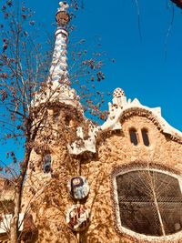 Low angle view of historical building against blue sky