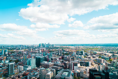 High angle view of city buildings against sky