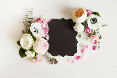 Close-up of rose bouquet against white background