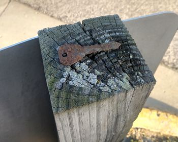 Close-up of rusty metal on wood