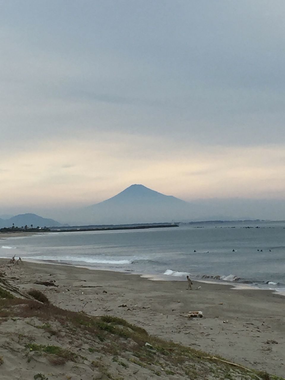 water, tranquil scene, sea, scenics, tranquility, beach, sky, mountain, beauty in nature, shore, nature, cloud - sky, sand, idyllic, coastline, mountain range, non-urban scene, cloud, outdoors, remote