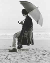 Woman standing on beach